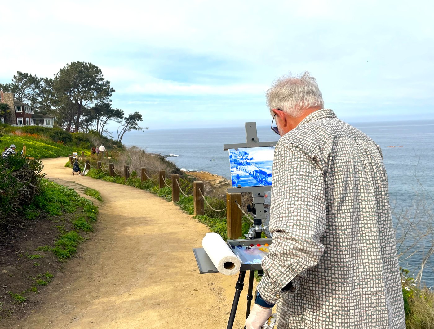 Ron Erickson painting outdoors on a coastal path